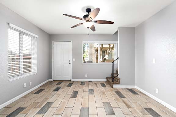 Bright Living room with ceiling fan at OSM Properties Homes & Apartments, Chico, CA 95926