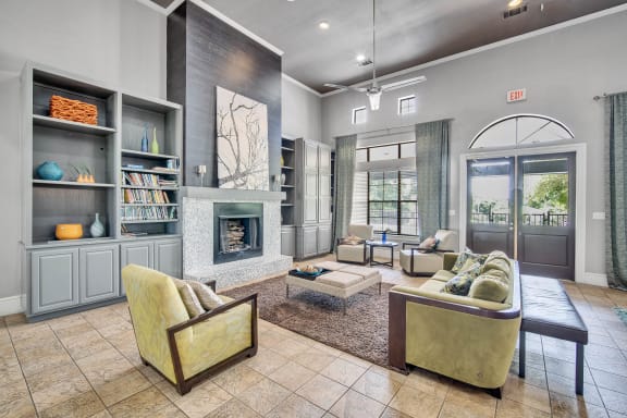 a living room with furniture and a fireplace