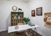 Thumbnail 7 of 19 - a dining room with a white table and chairs