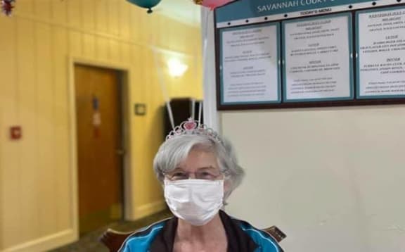 woman with a face mask at Savannah Court of Camilla, Georgia