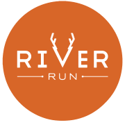 an orange circle with the river run logo