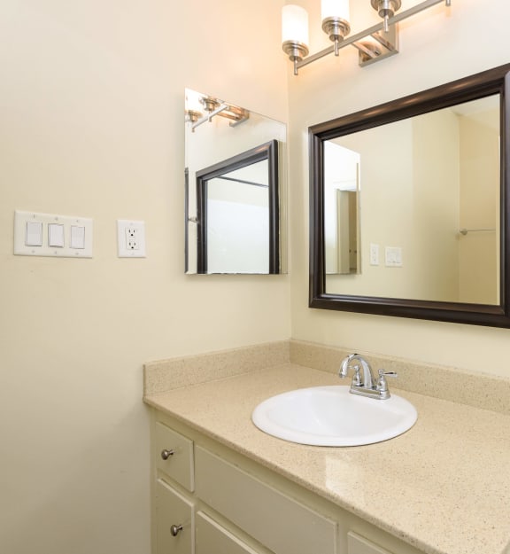a bathroom with a sink and mirror