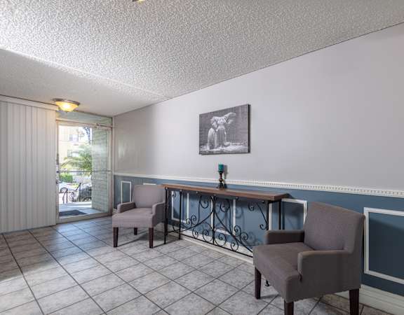 a common area with chairs and a table