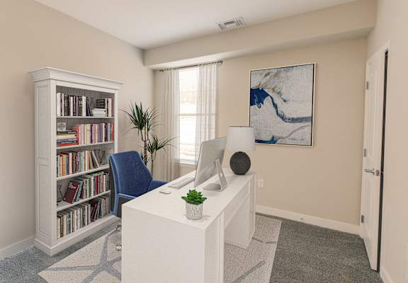 a home office with a white desk and a computer