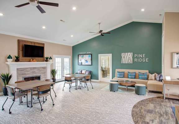 Living Area with Fireplace and Seating at Pine Ridge Apartments, Rochester Hills, MI, 48307