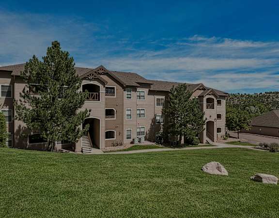Beautifully manicured landscaping - Grand Centennial Apartments