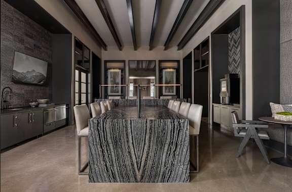 A modern living room with a grey and black color scheme.