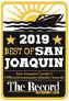 a sign that says best of san joaquin and a boat on the water