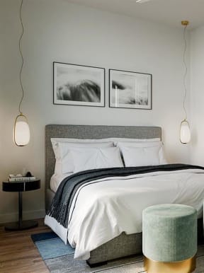 a bedroom with a bed and a mirror