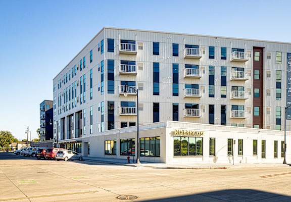 a new apartment building on the corner of a city street at Riverhouse Apartments, Fargo, North Dakota 58102