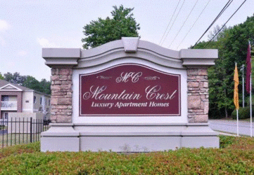 a sign that says mccausland creek luxury apartment homes