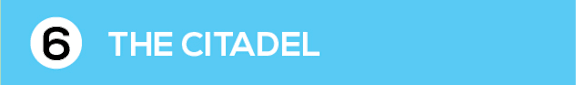 A blue background with a white circle and the number 6 and the words The Citadel.