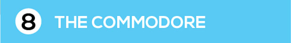 A blue sign with the number 8 and the words "The Commodore" on it.