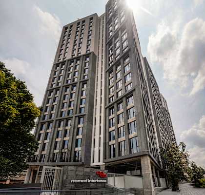 A tall building with the words "modern interiors" written on it.