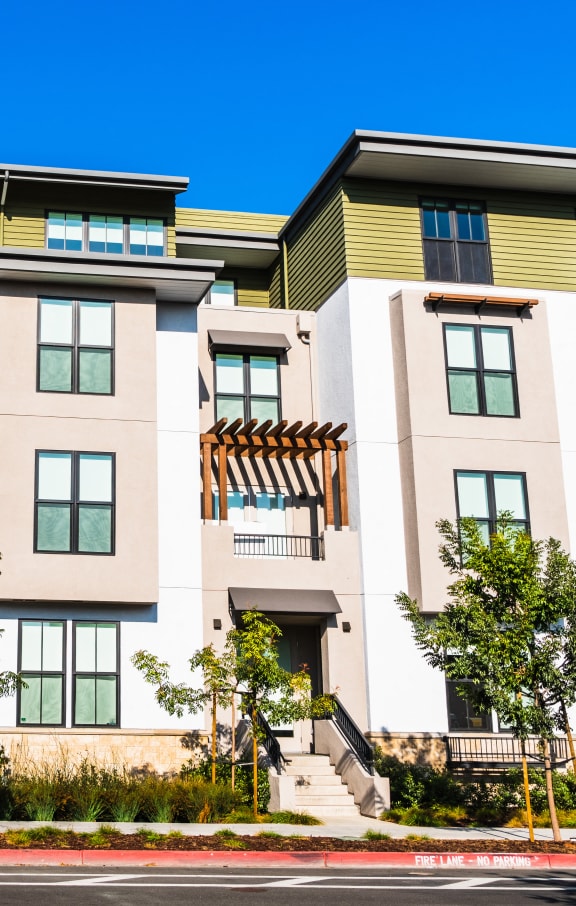 a row of apartment buildings on a city street