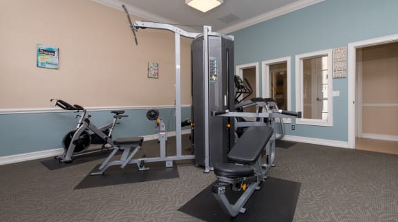 a fitness room with exercise equipment