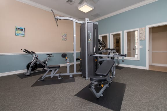 a fitness room with exercise equipment