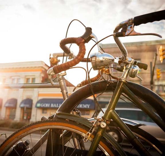 a bike parked on the side of a street