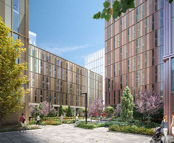 A modern building with a garden in front.