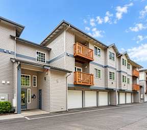 Apartment complex with multiple buildings and garages.
