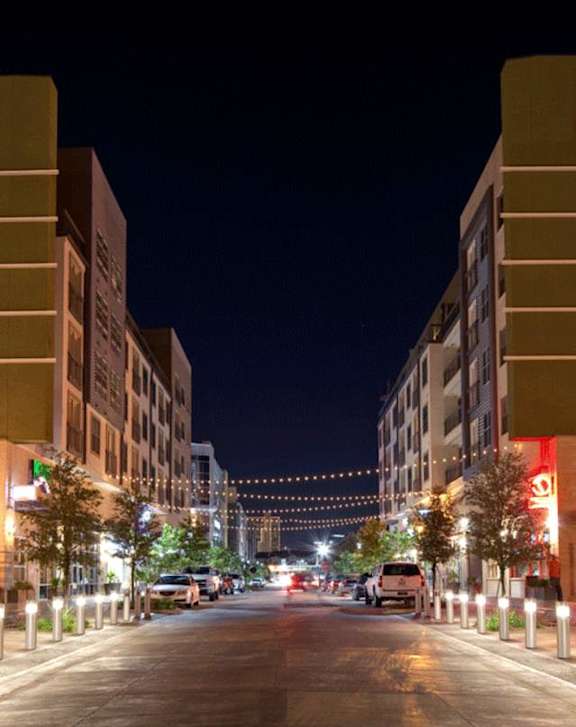 A street view of Legal Cinemas 16 with a clear sky above.