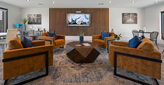 A living room with a brown sofa and a wooden coffee table.
