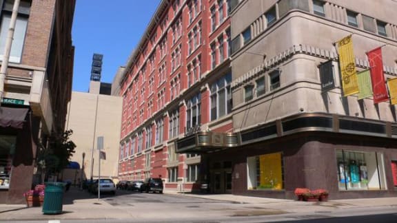 a city street with a large building on the side of it