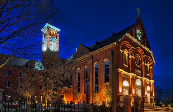 a large brick building with a clock tower