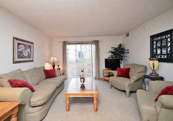 a dining room and kitchen with a table and chairs