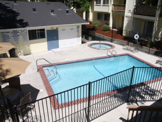 a swimming pool with a fence around it