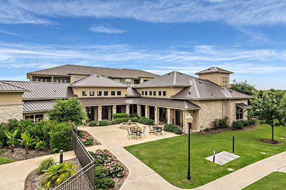 a large building with a courtyard in front of it