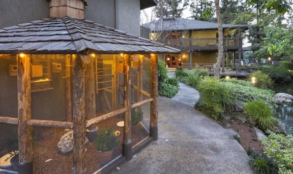 a porch with a screened in porch with lights