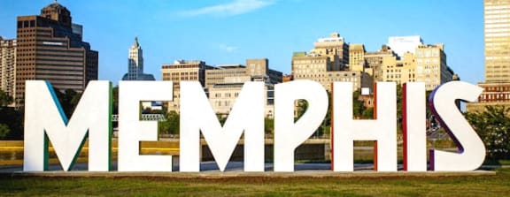 a view of the city with the letters memphis in the foreground