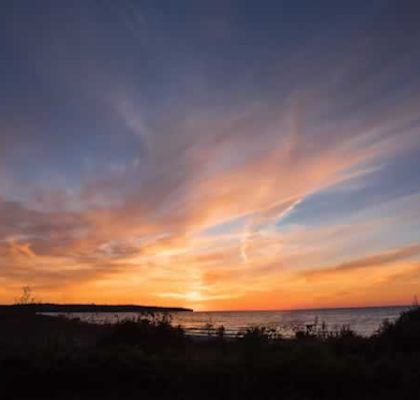 A beautiful sunset with clouds in the sky.