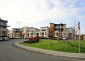 Thumbnail 1 of 7 - a street with some houses on the side of it