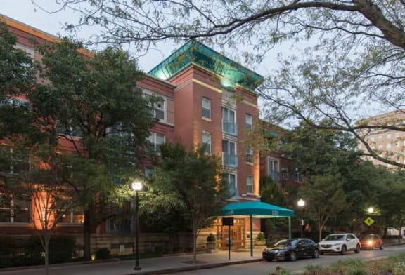 a large brick building with a green awning