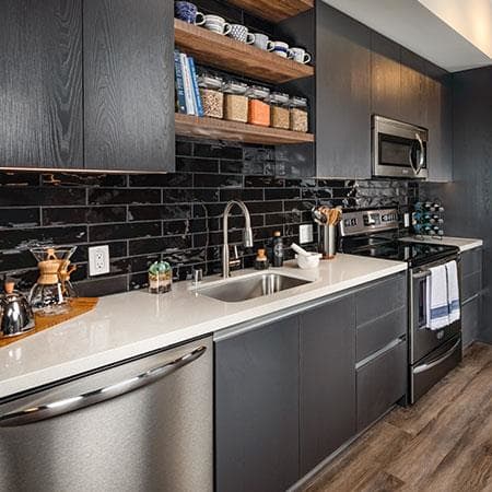 a kitchen with a sink stove and refrigerator