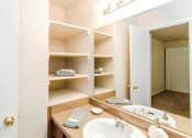Thumbnail 9 of 18 - Bathroom with Oversized Vanity Mirror, Overhead Lighting, and Built-In Storage