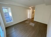 Thumbnail 25 of 41 - Bedroom with wood flooring and windows at unit 203, 739 South Ogden Drive.