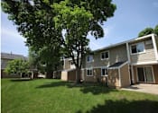 Thumbnail 6 of 17 - backyard of townhomes