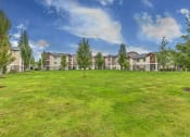Thumbnail 40 of 63 -  Lush Green Landscaping Of Community With Maintained Grass And Trees at BELLA SONOMA, Washington, 98424