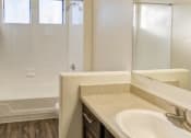 Thumbnail 18 of 24 - Ingleside Apartments Bathroom with hardwood style flooring and white countertops