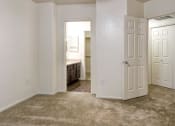 Thumbnail 20 of 24 - Ingleside Apartments Bedroom with wall to wall carpet and attached bathroom
