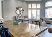 Thumbnail 7 of 24 - Ingleside Apartments Clubhouse dining table with blue wooden chairs