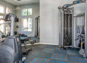 Thumbnail 11 of 24 - Ingleside Apartments Fitness Center with cardio and weight machines
