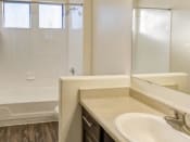 Thumbnail 18 of 24 - Ingleside Apartments Bathroom with hardwood style flooring and white countertops