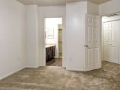Thumbnail 20 of 24 - Ingleside Apartments Bedroom with wall to wall carpet and attached bathroom