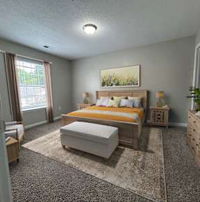 A bedroom with a bed, dresser, and window.