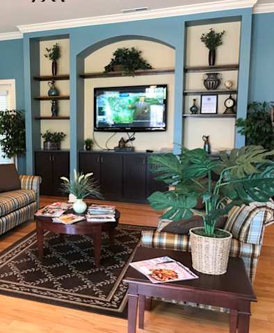 a living room with a couch and a table and a television