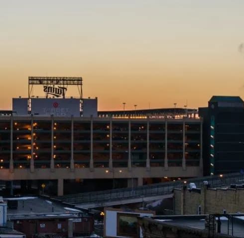 a city skyline with a large building in the middle